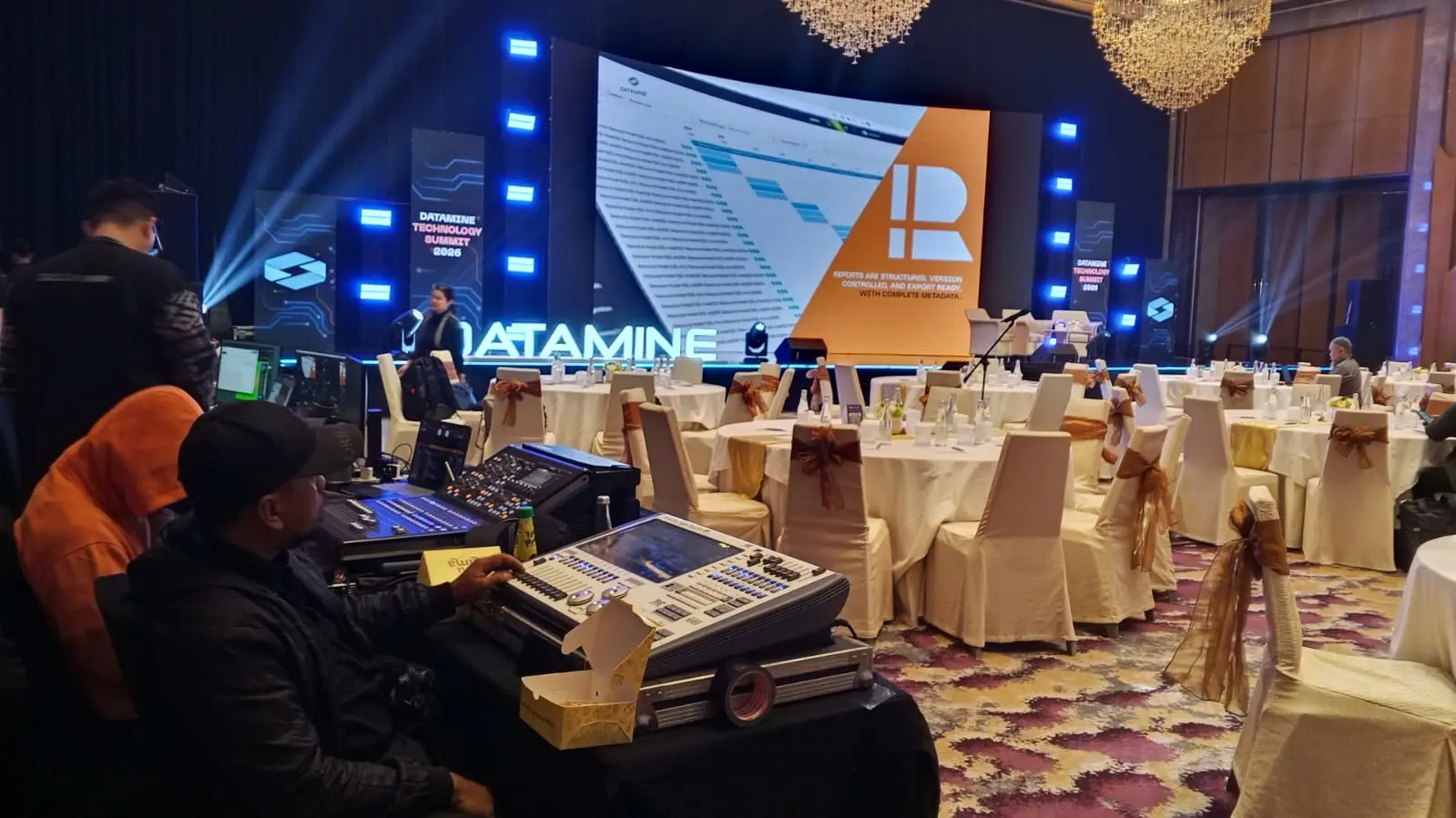 A control desk facing the Datamine Technology Summit stage.